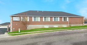 visual of a brown house with grey roof